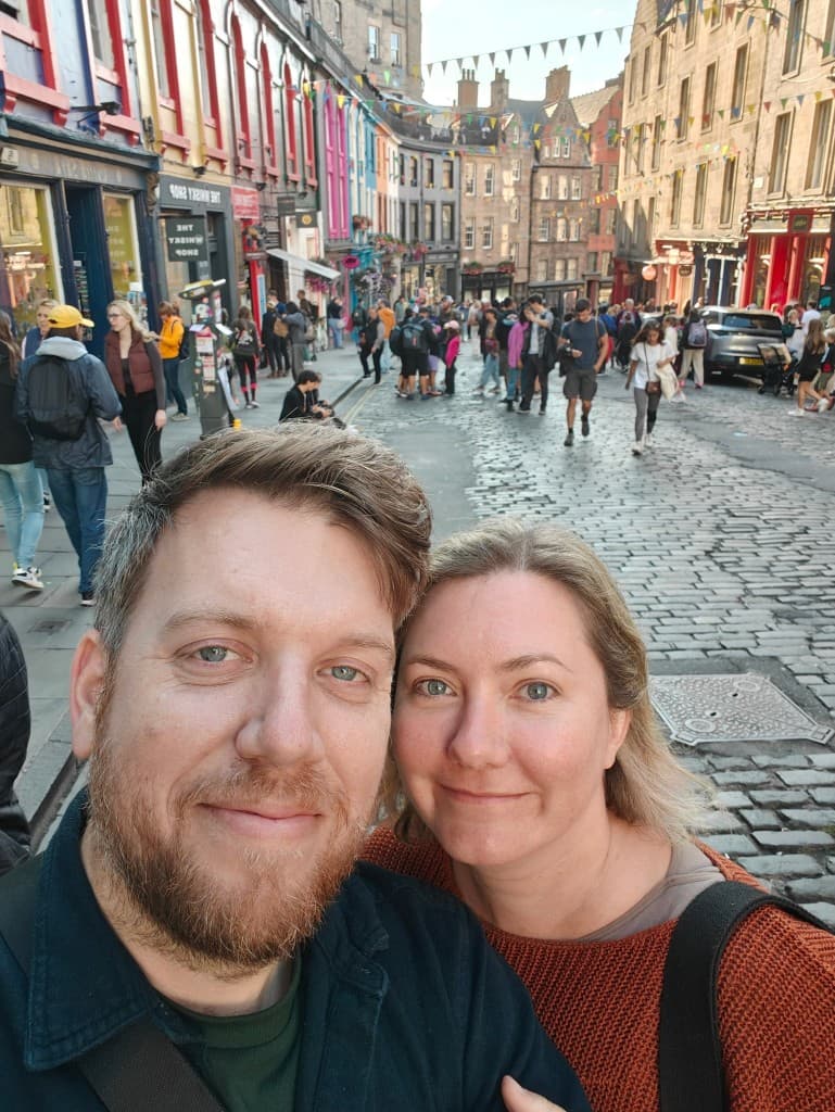 Leigh and Tom taking a selfie on a busy Edinburgh street