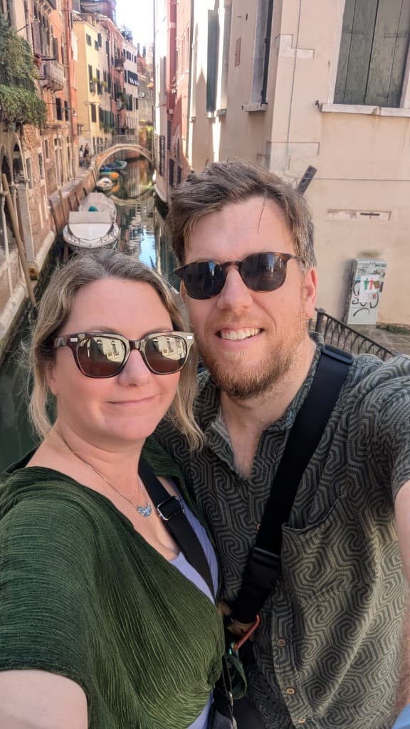 Leigh and Tom on a bridge above a Venice canal